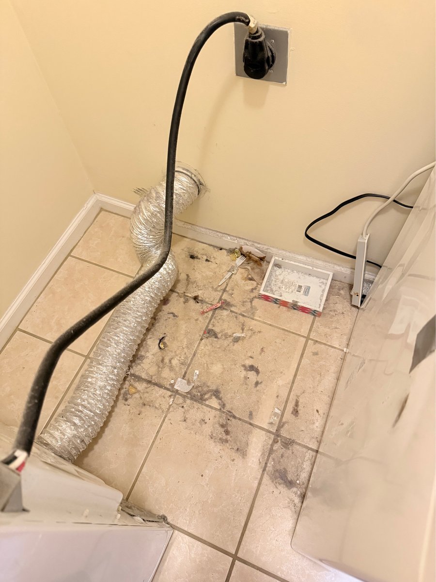 Laundry area before cleaning
